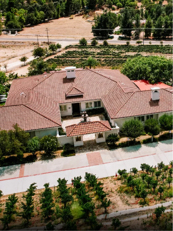 Aerial view of a vineyard estate surrounded by Temecula Valley wine country at a Kentina Hospitality destination