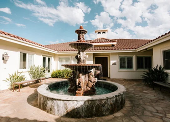Elegant courtyard fountain surrounded by Mediterranean-style architecture at a luxury Temecula Valley estate and event venue