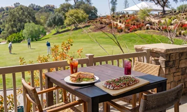 Outdoor patio dining overlooking a championship golf course in Temecula Valley with scenic fairway views, handcrafted cuisine, and resort-style hospitality experiences