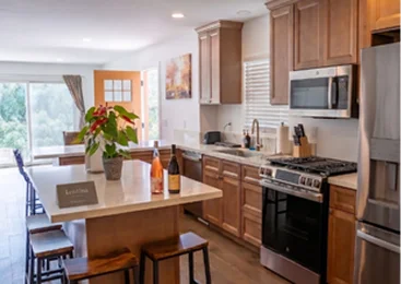 Modern kitchen and dining area inside a luxury vacation rental property in Temecula Valley with premium amenities and comfortable accommodations
