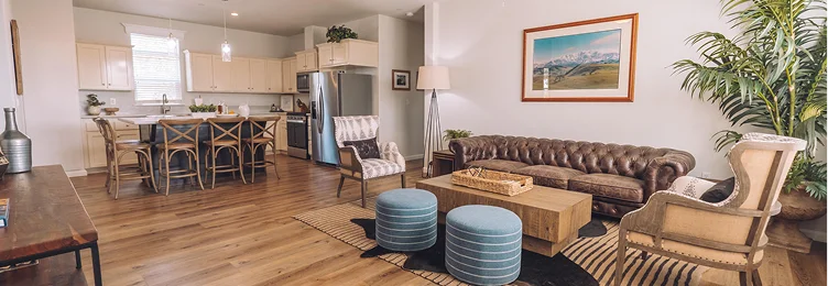 Spacious open-concept living room and fully equipped kitchen inside a luxury vacation rental in Temecula Valley with modern furnishings and premium amenities.