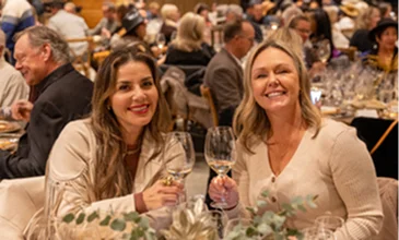 Guests enjoying wine and conversation during a social event and hospitality gathering in Temecula Wine Country surrounded by fellow wine enthusiasts and community members